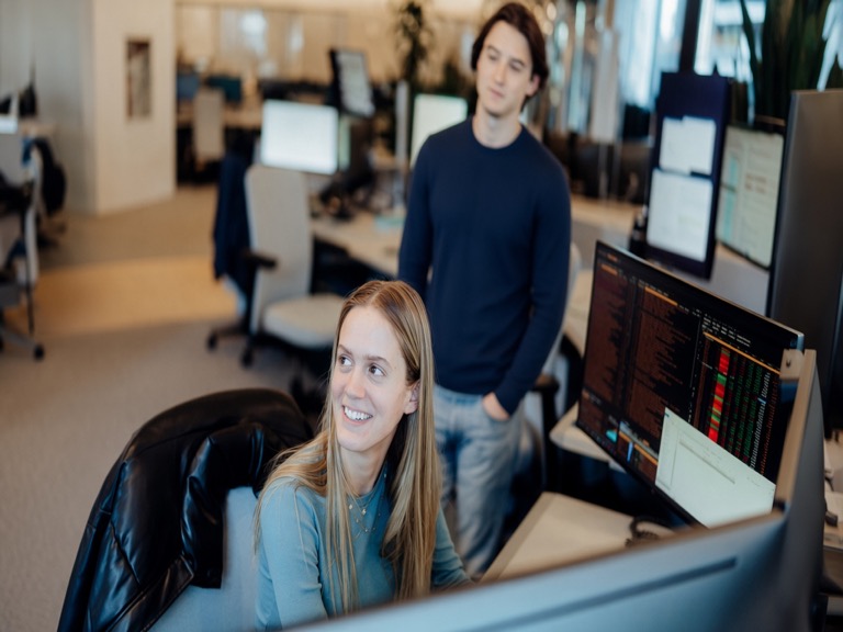 Academy analyst working at desktop computer